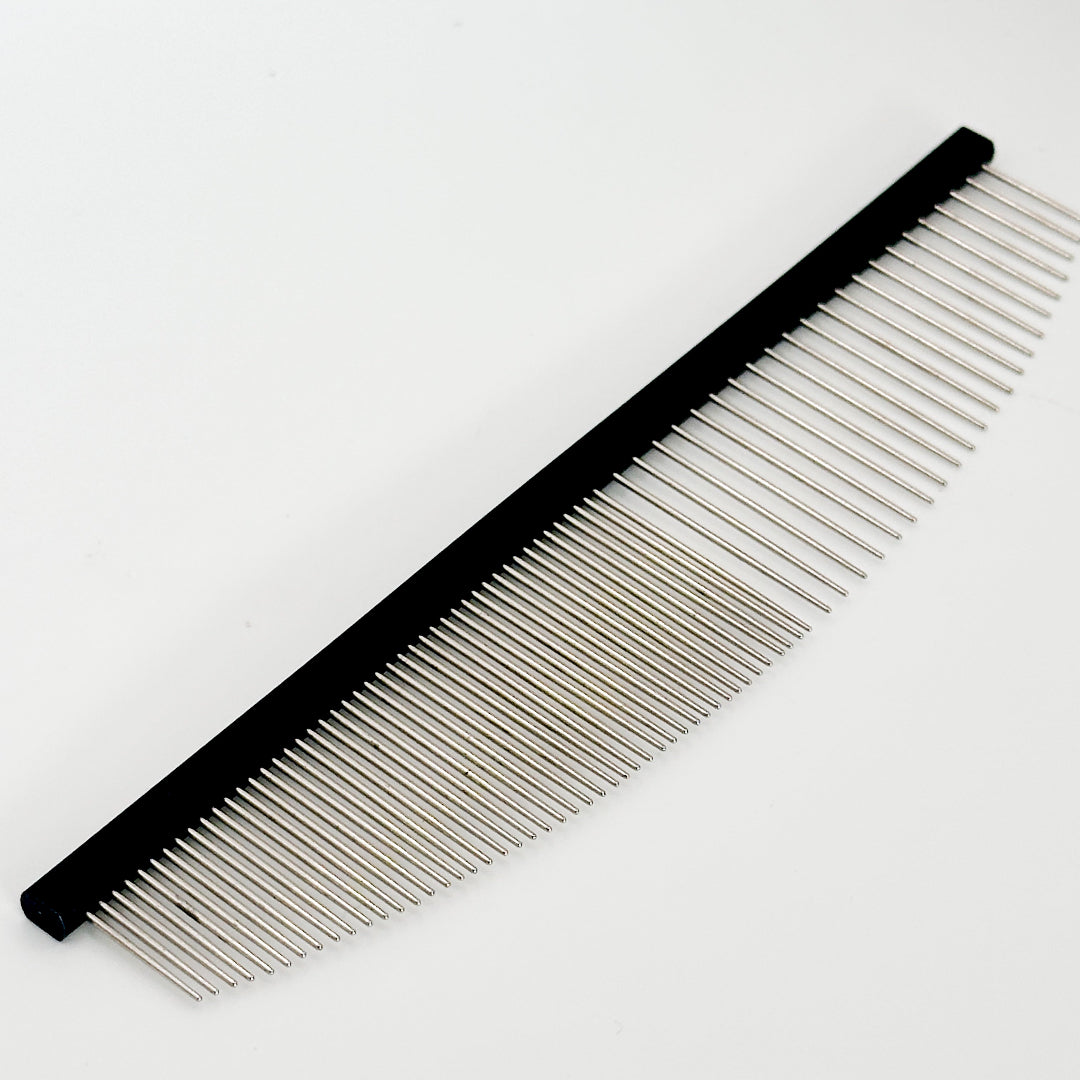 NorrGroom 6.5 inch grooming comb beside a freshly groomed dog with a smooth, polished coat