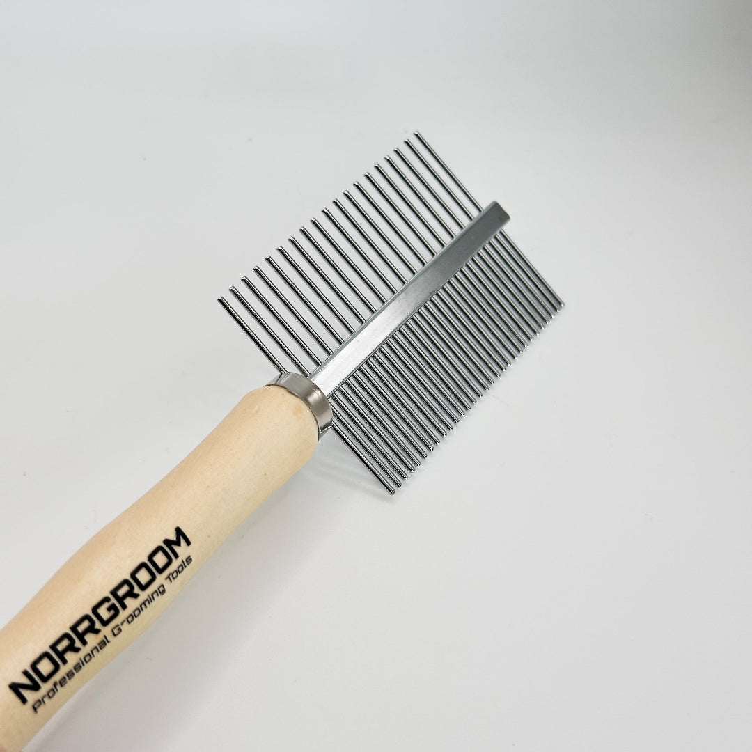 norrgroom Pet grooming brush with wooden handle and metal teeth on a light gray background