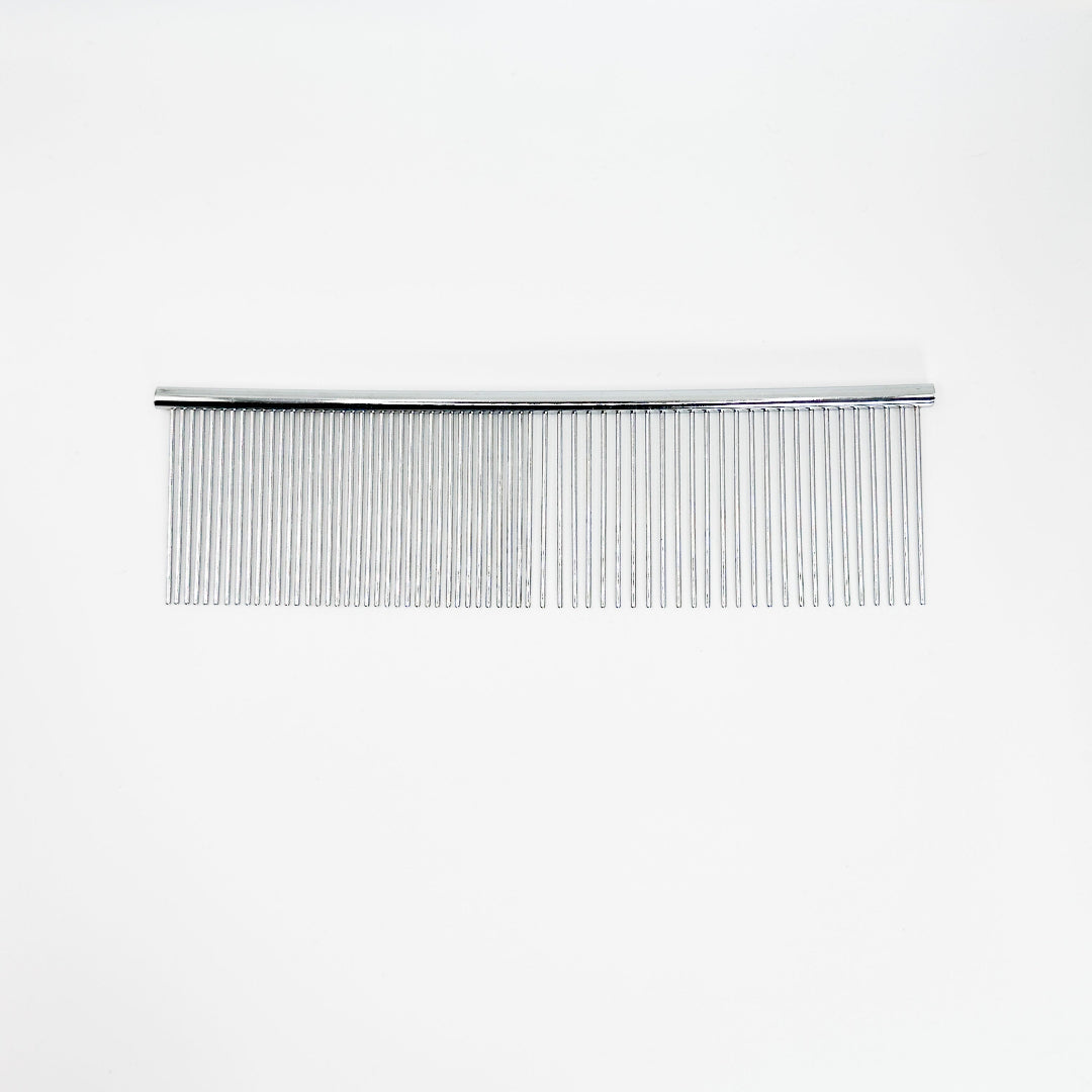 NorrGroom 7.5 inch fine and coarse dog comb beside a large, double-coated dog post grooming

